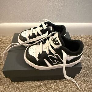New Balance Kids Black and White Lace-Up Sneakers
